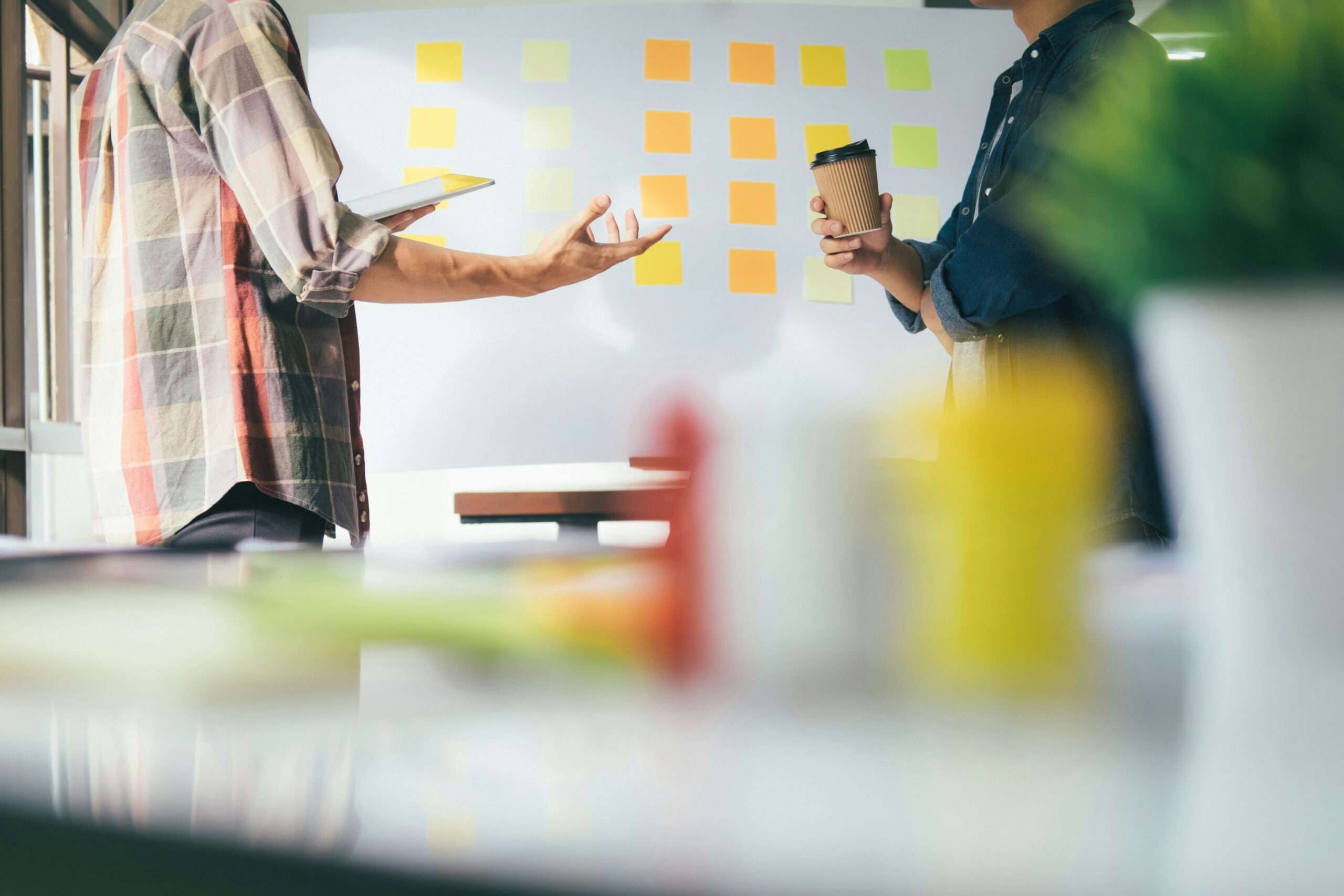 Team standing discussing ideas